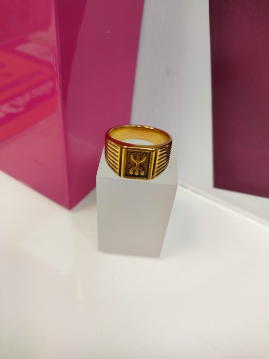 9-9-75634-1-Anillo acero dorado con simbolo bereber T27